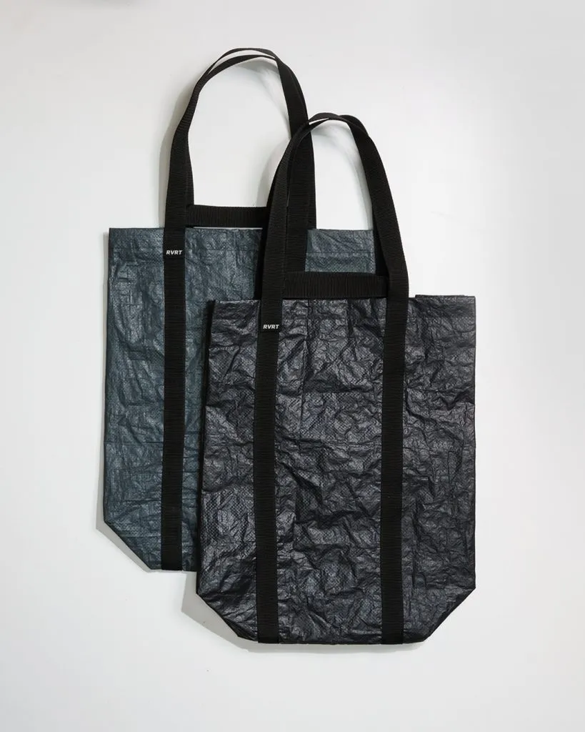 Black Upcycled Tote Bags with crumpled texture and RVRT logo.