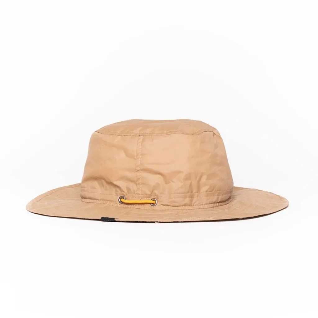 Beige bucket hat with chin strap and drawstring.
