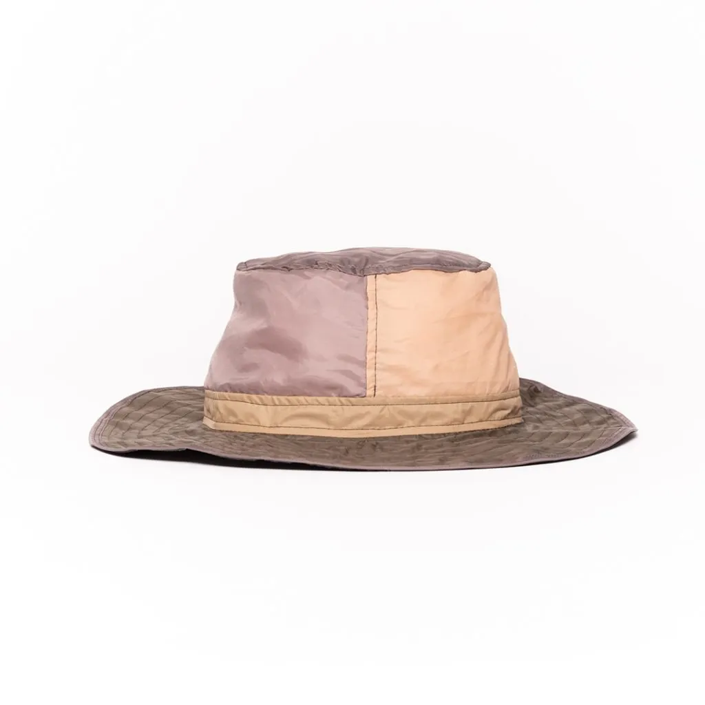 Upcycled hat with colorblock design and wide brim.